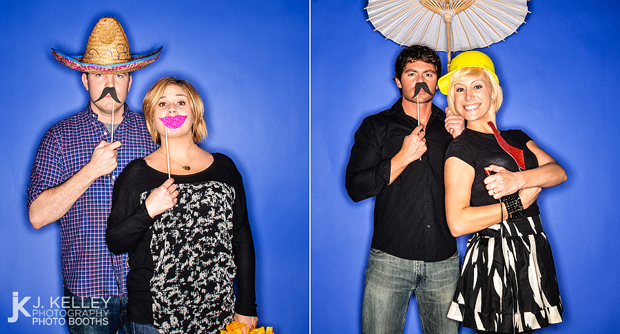 Couples take their pictures in a photo booth at a party in St. Louis