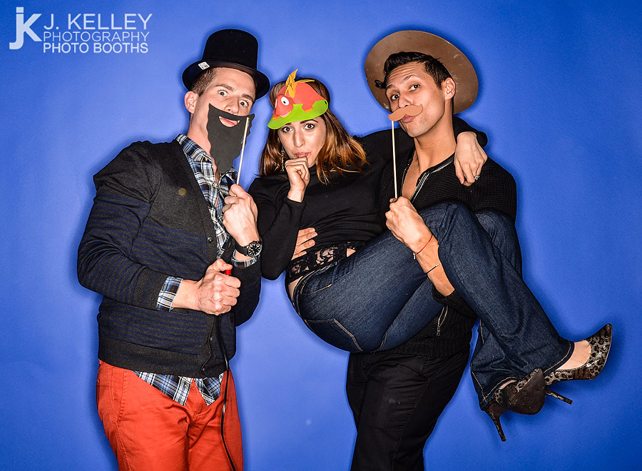 Props on a stick are used by party goers in a photo booth at a party in Columbia Missouri