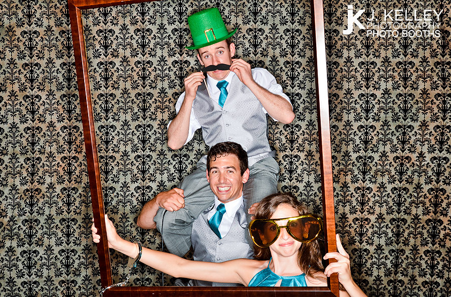 Family members take their own picture in an affordable Columbia, Mo. photo booth rental