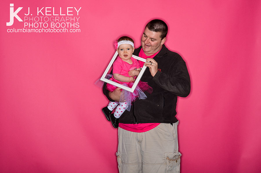 Baby in photo booth with her father in Columbia Mo