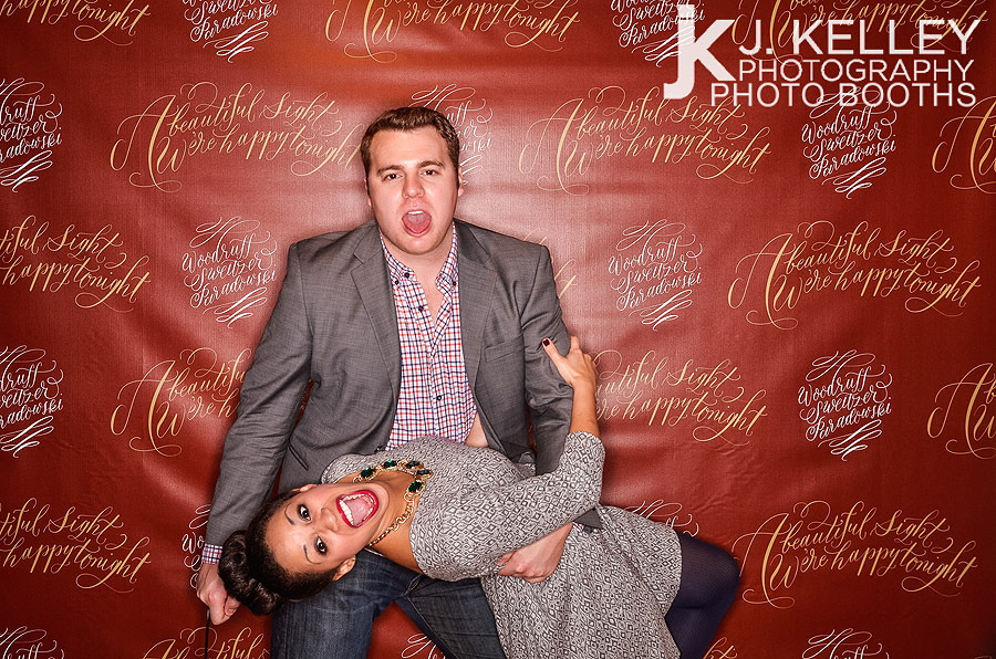 Man dips woman in an open air photo booth in Columbia, Missouri 