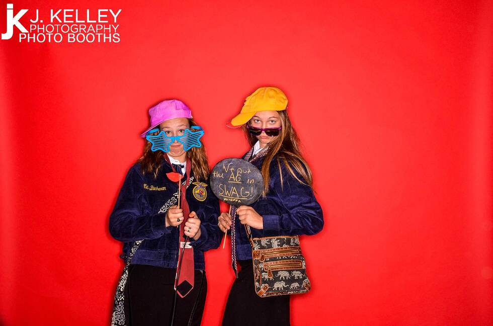 Ag in Swag, two high school girls, props on a stick, silly glasses, Columbia Missouri