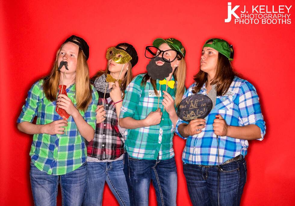 plaid shirts, group photo, bright red backdrop, Columbia Missouri photo booth, group photo